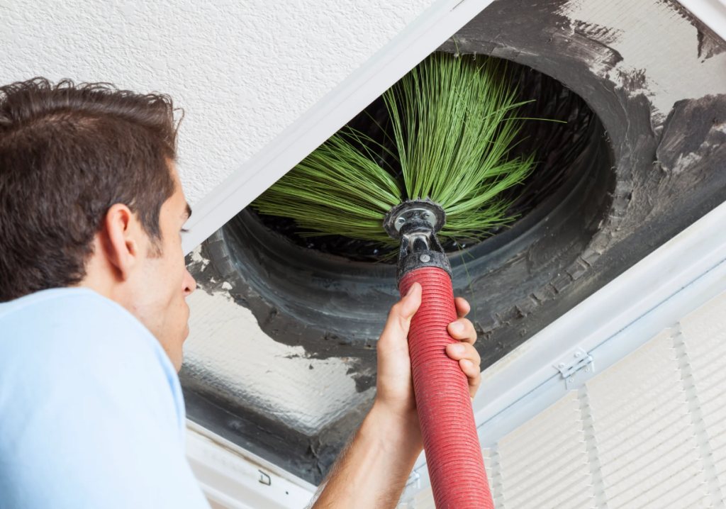 A man performing Duct cleaning