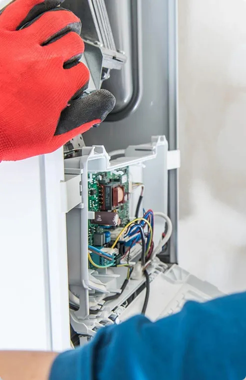 Technician making a furnace repair
