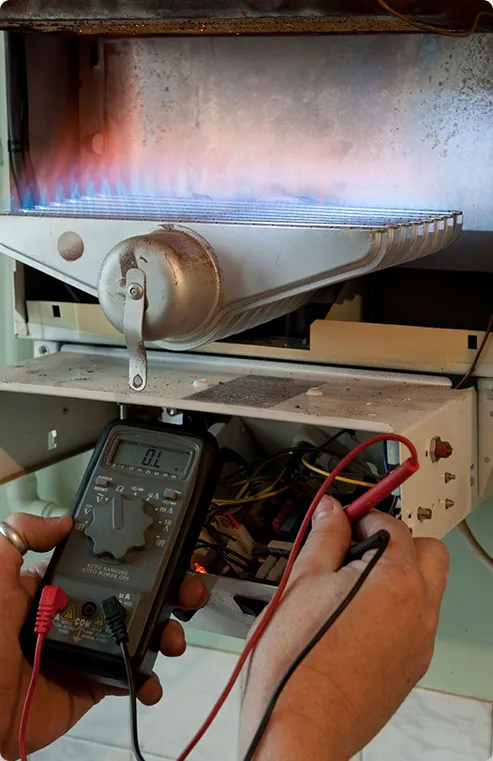 Worker inspecting a furnace